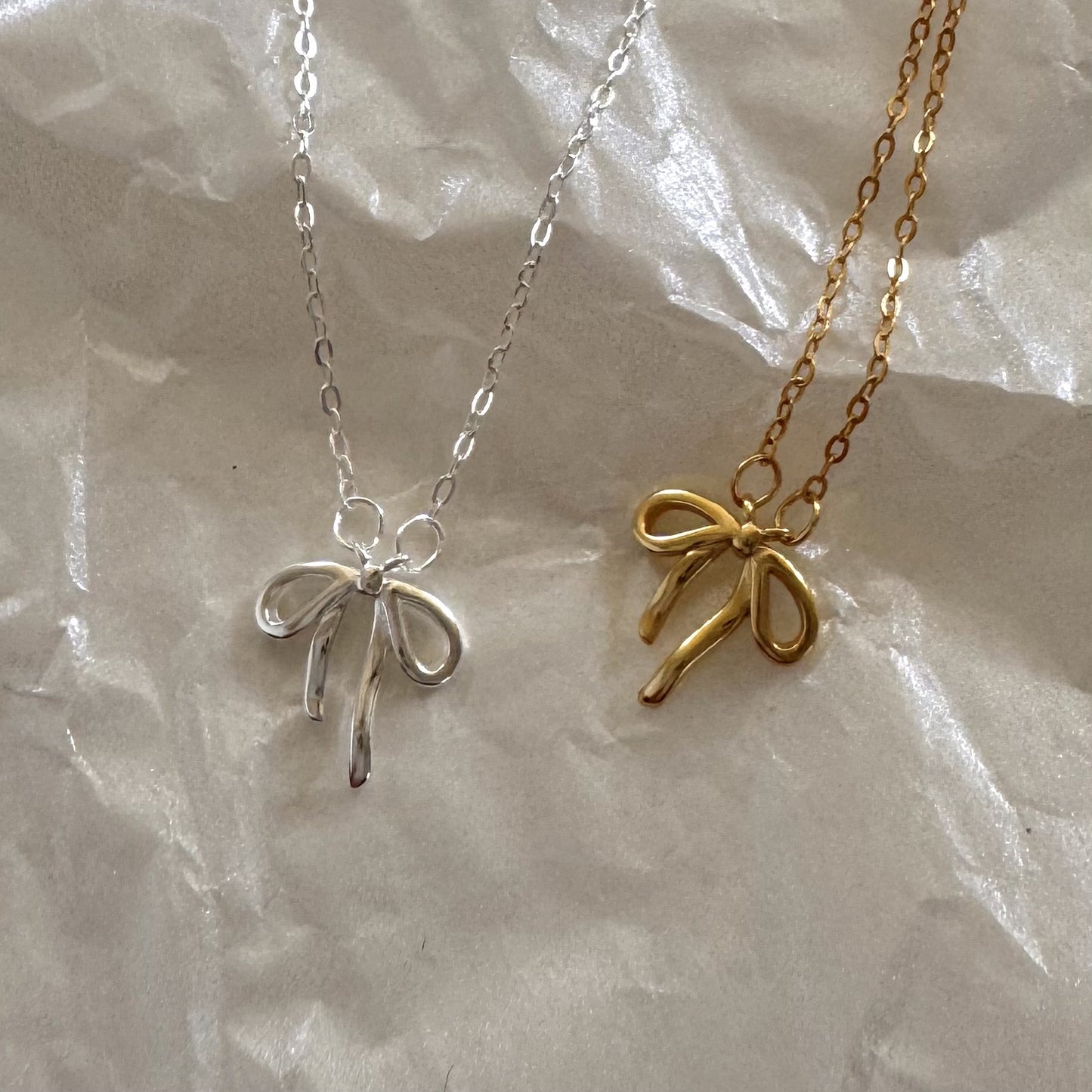 Minimalist Bow Knot Pendant Necklace in 925 Sterling Silver with Plated Finish on Cross Chain