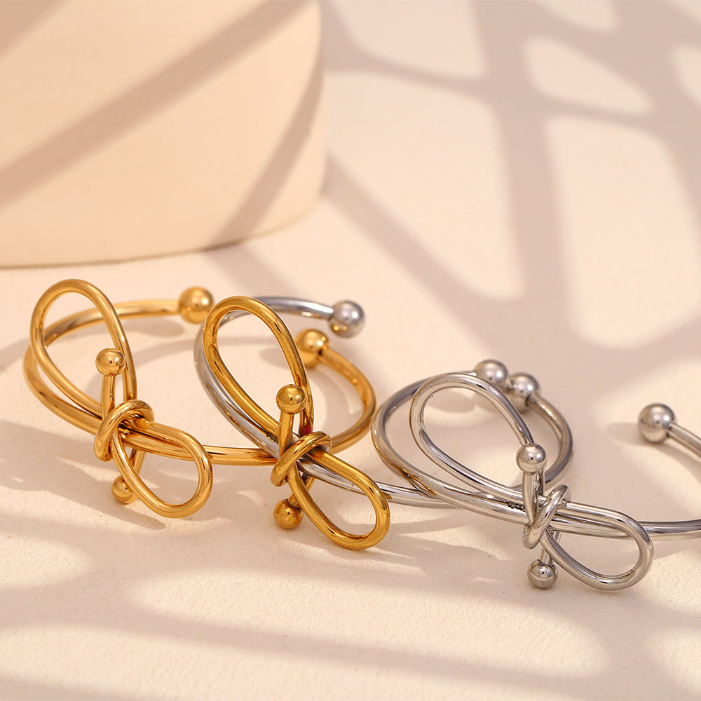 Bracciale da donna in acciaio inossidabile placcato oro 18K con fiocco, stile minimalista e alla moda