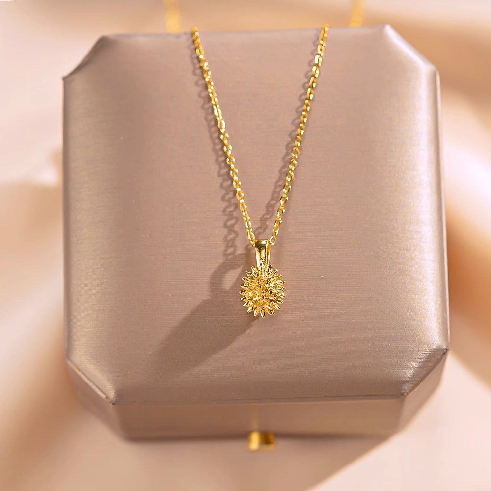 Collana con ciondolo geometrico a forma di durian fresco e dolce da donna in acciaio al titanio placcato