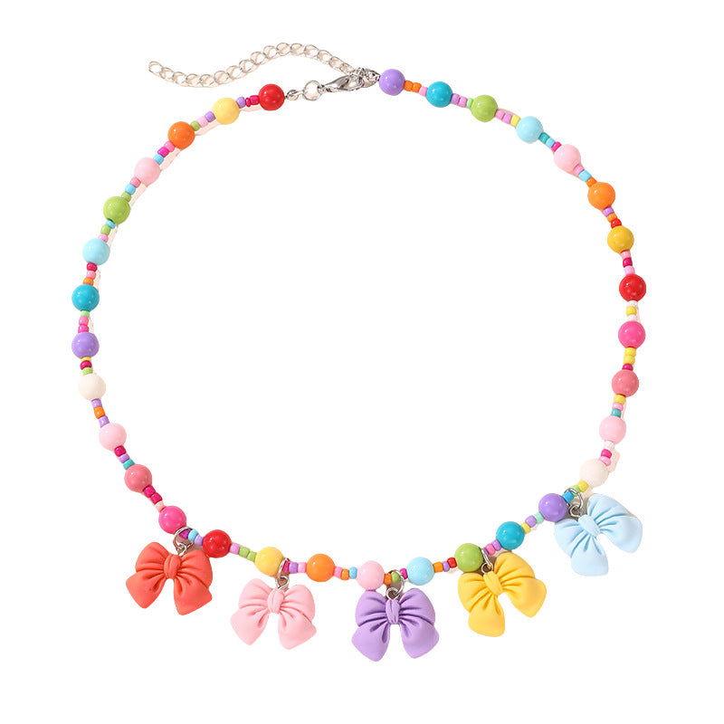 Collana con ciondolo a fiocco dolce pastello per ragazze con ciondolo in resina su catena a O, gioielli in stile cartone animato