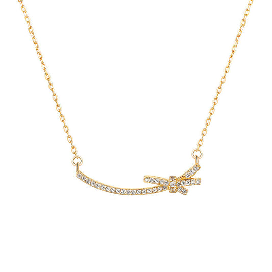 Collar minimalista con forma de lazo de acero de titanio para mujer con colgante de aleación y diseño de cadena cruzada