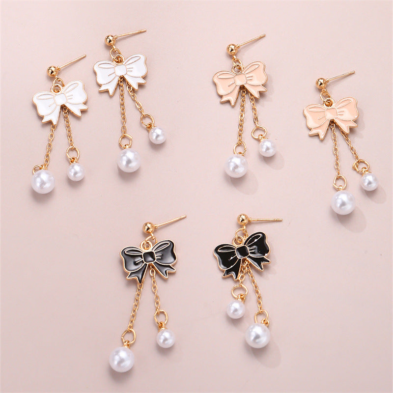 Bonitos aretes de aleación con borla de perlas y lazo de esmalte para niños