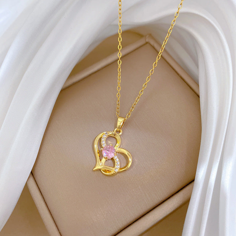 Collana da donna in acciaio al titanio a forma di cuore irregolare con finitura placcata, ciondolo geometrico minimalista e catena sottile a medaglione