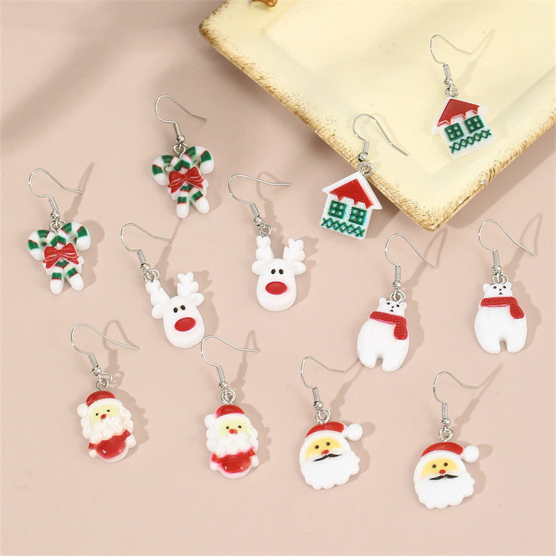 Set de pendientes infantiles con temática navideña con copo de nieve, cascabel y colgante de árbol de Navidad en material de resina