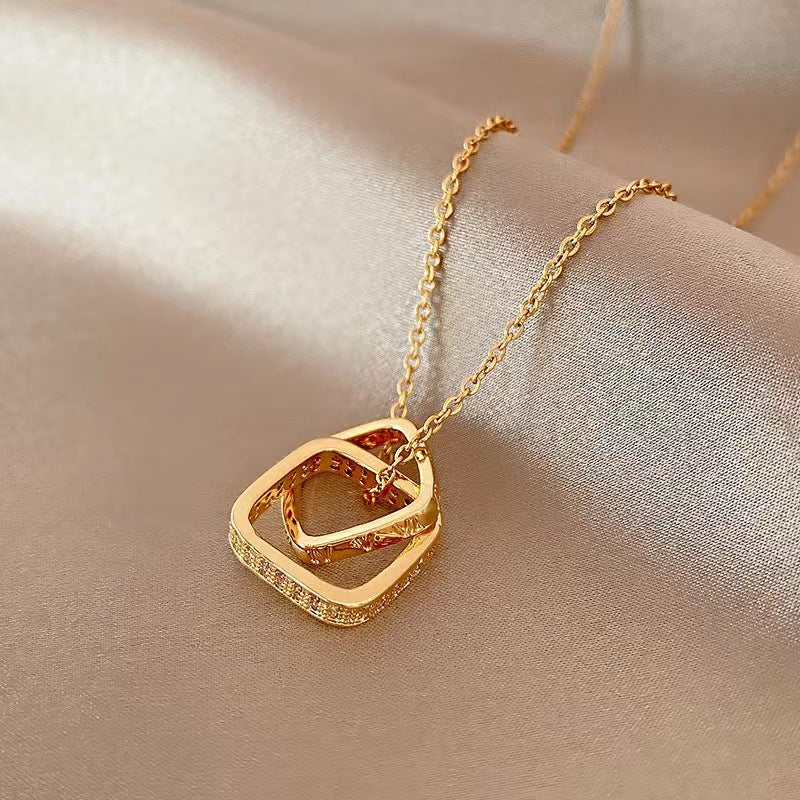 Minimalist Geometric Double Ring Pendant Necklace for Women in Titanium Steel with 18K Gold Plating and Micro-Pave Zirconia