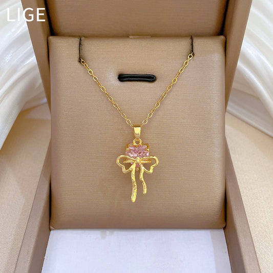 Collar con colgante de lazo rosa de diamantes de imitación para mujer en acero de titanio con delicada cadena de locket