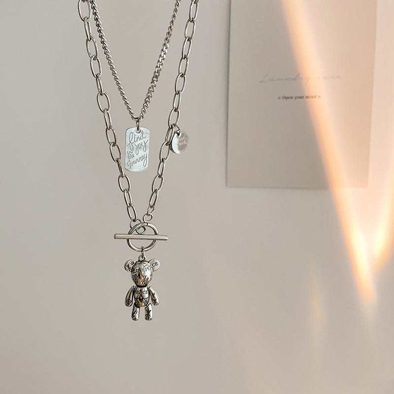 Collar largo de suéter minimalista de acero de titanio con dije de oso y acabado chapado para mujer y hombre