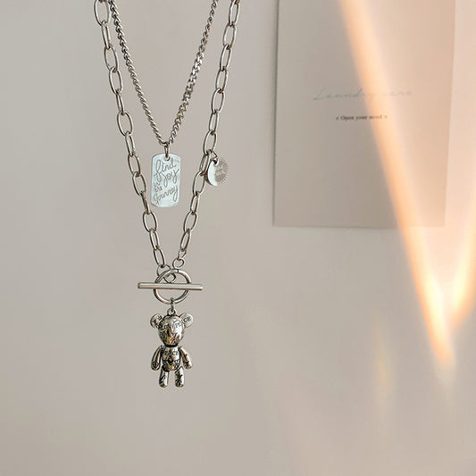 Ciondolo orsetto minimalista in acciaio al titanio, collana lunga a strati per maglione da donna e da uomo con finitura placcata