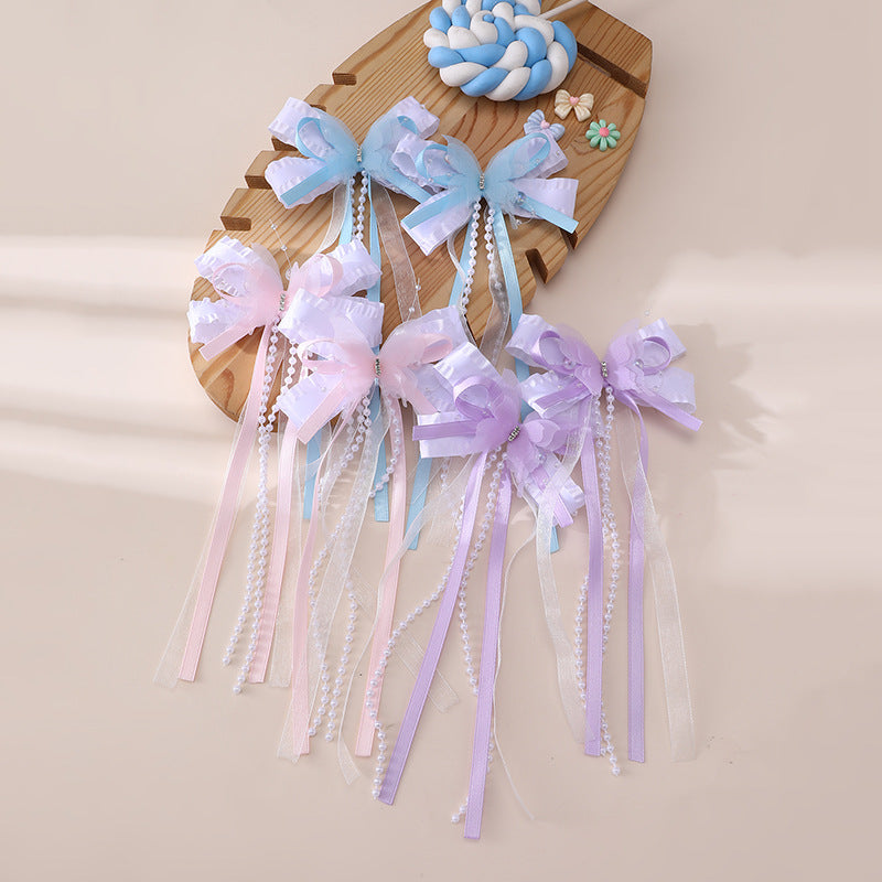 Pinza de pelo en forma de lazo de estilo natural para niños con detalles de volantes y malla hecha de resina plástica