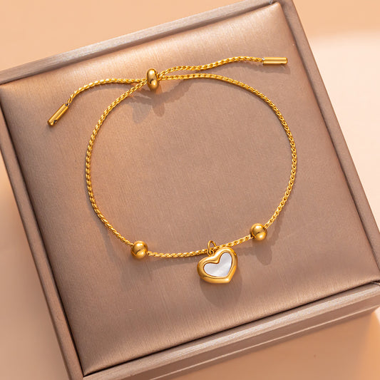 Bracciale Minimalista in Acciaio al Titanio a Forma di Cuore con Intarsio in Madreperla Bianca e Chiusura a Scorrimento da Donna