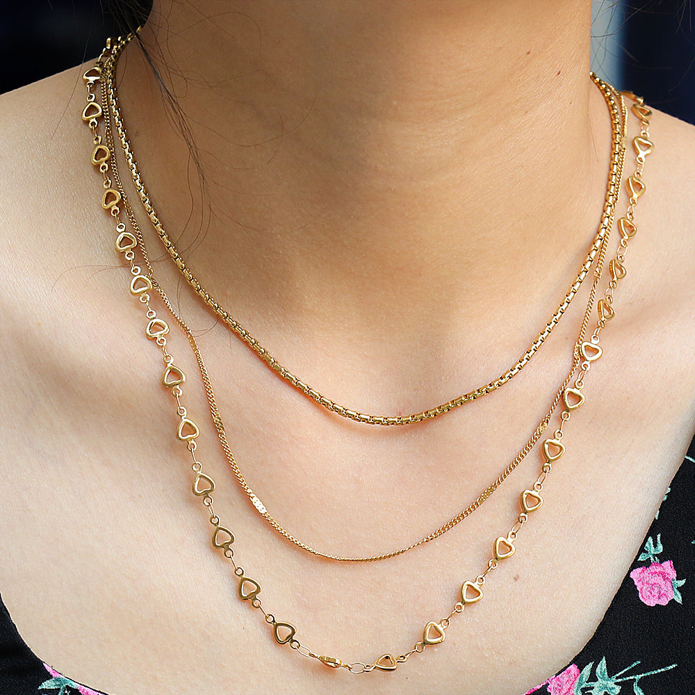 Collar en capas de corazón minimalista de acero de titanio chapado en oro de 18 quilates para mujer