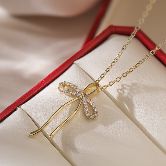 Collana pendente minimalista a forma di fiocco in rame con placcatura in oro vero e zirconi per donna