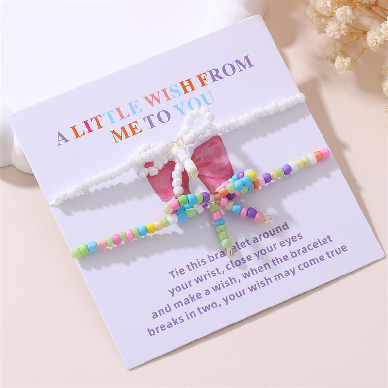 Set di braccialetti per bambini in stile bohémien con fiocco in perle di plastica e resina con accenti di cristallo bianco