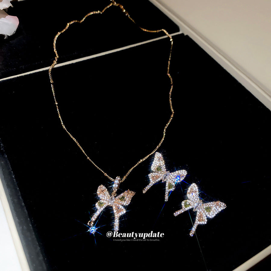 Elegante set di collana e orecchini in rame a forma di farfalla con intarsio di zirconi da donna