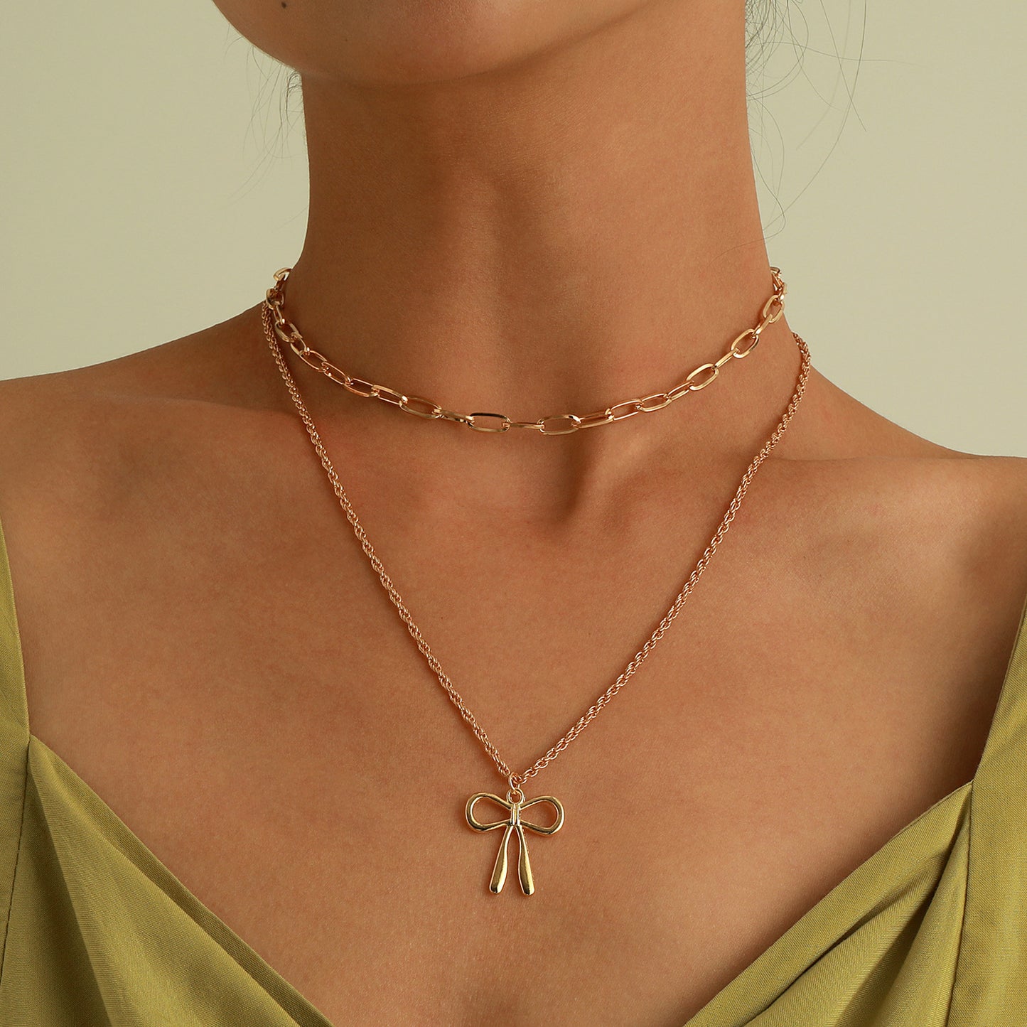 Punk Style Bow-Shaped Alloy Pendant Necklace with Plated Finish and Double-Layer Cross Chain
