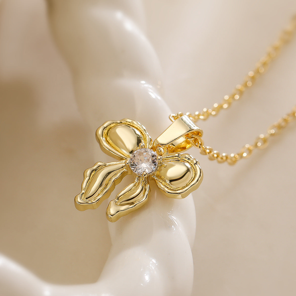 Minimalist Bowknot Pendant Necklace for Women in Copper with 18K Gold Plating and Zircon Accents