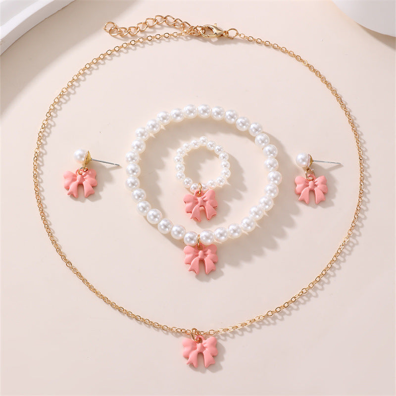 Conjunto de collar y pulsera de perlas dulces con colgante de lazo para niños en material de resina con acabado esmaltado