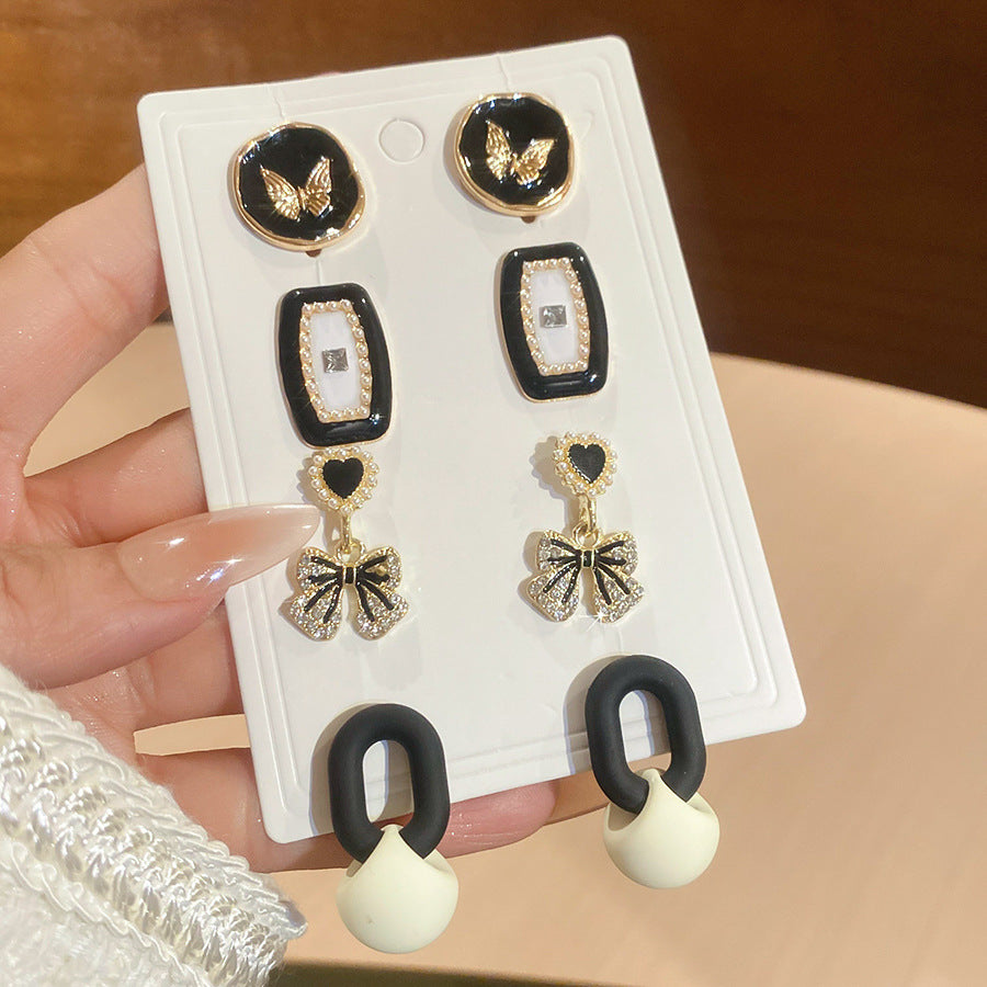 Orecchini a perno eleganti retrò a forma di fiocco con intarsio di strass e perni in acciaio per donna