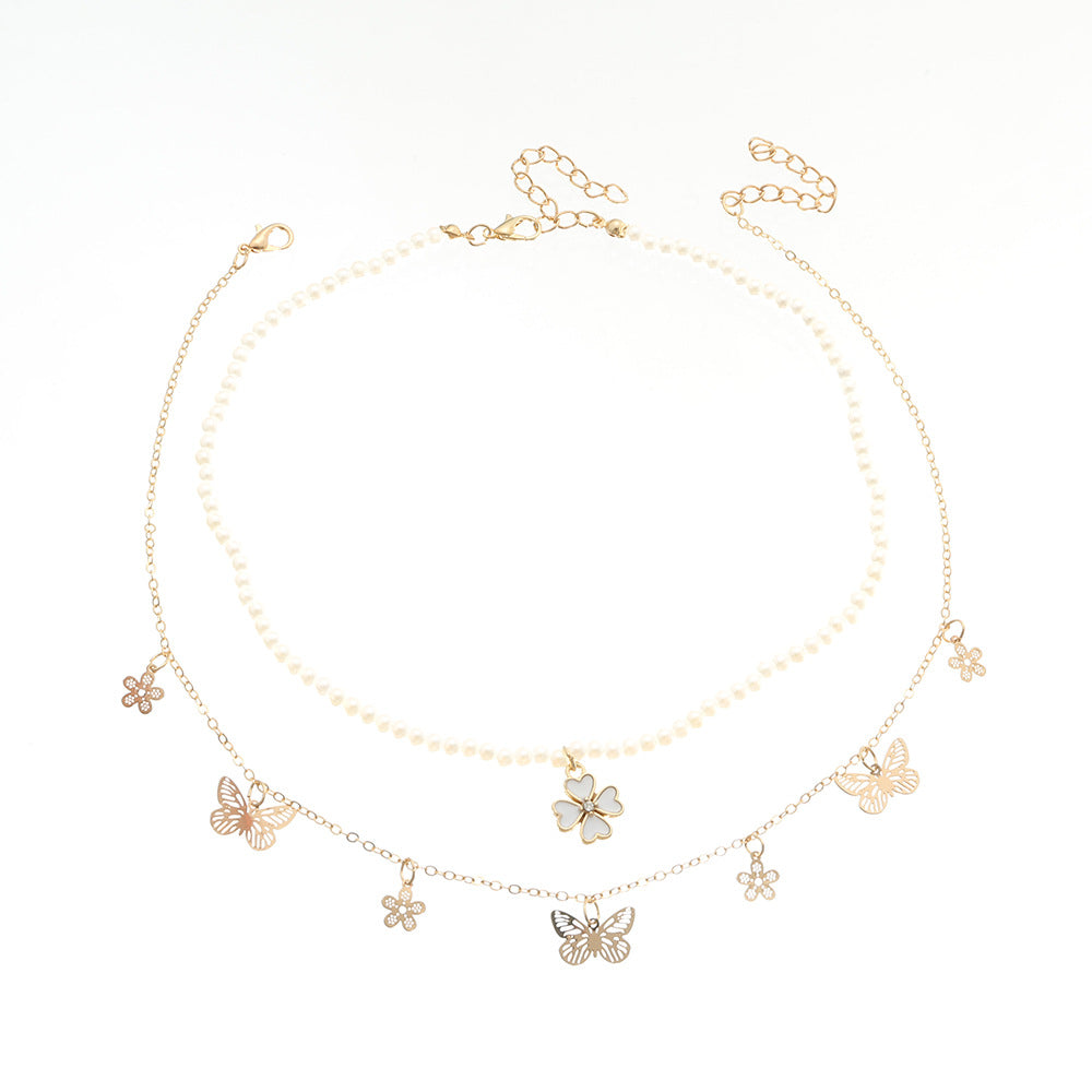 Collar minimalista de aleación con forma de mariposa y cadena de perlas para niñas de 6 años en adelante, collar con colgante de trébol de cuatro hojas y cuentas