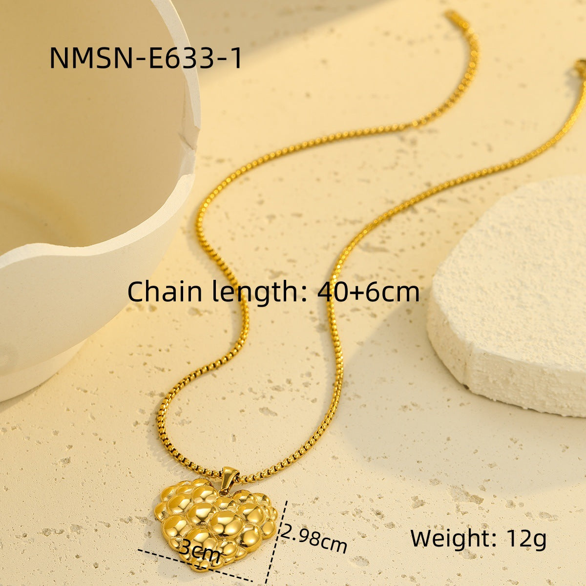 Elegante collar de acero de titanio con forma de corazón para mujer con acabado chapado y detalle de burbuja
