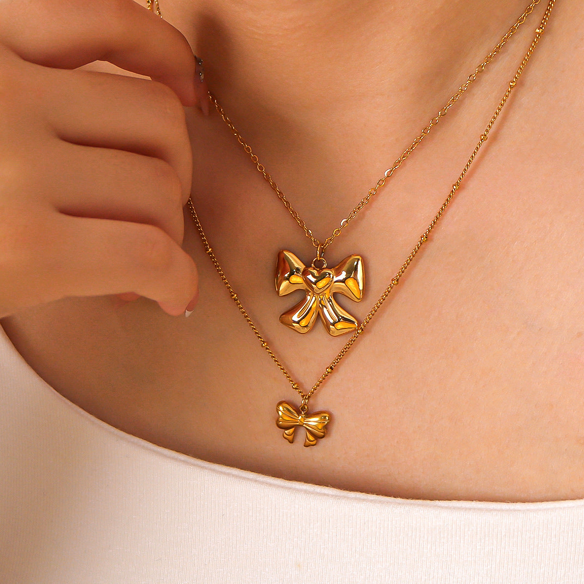 Collana da donna con ciondolo a fiocco geometrico in acciaio inossidabile placcato oro 18 carati, gioiello di moda ipoallergenico