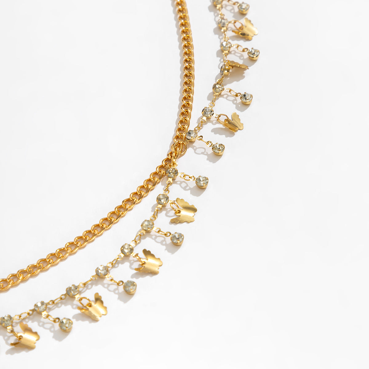 Cadena corporal minimalista con diamantes de imitación, multicapa, con dijes de mariposa y concha marina y detalles de borlas para mujer