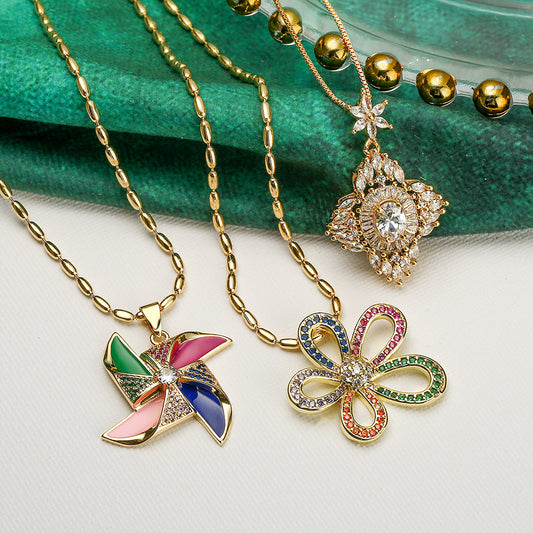 Collana con pendente a forma di fiore di mulino a vento geometrico irregolare minimalista da donna in rame con accenti di strass