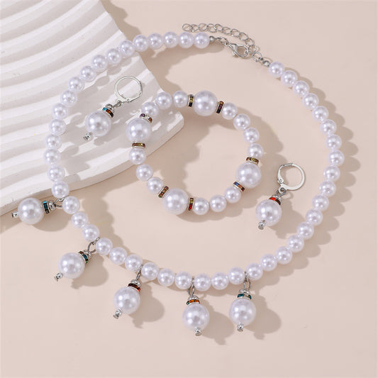Conjunto de collar, aretes y pulsera minimalistas con perlas y lazo para niñas