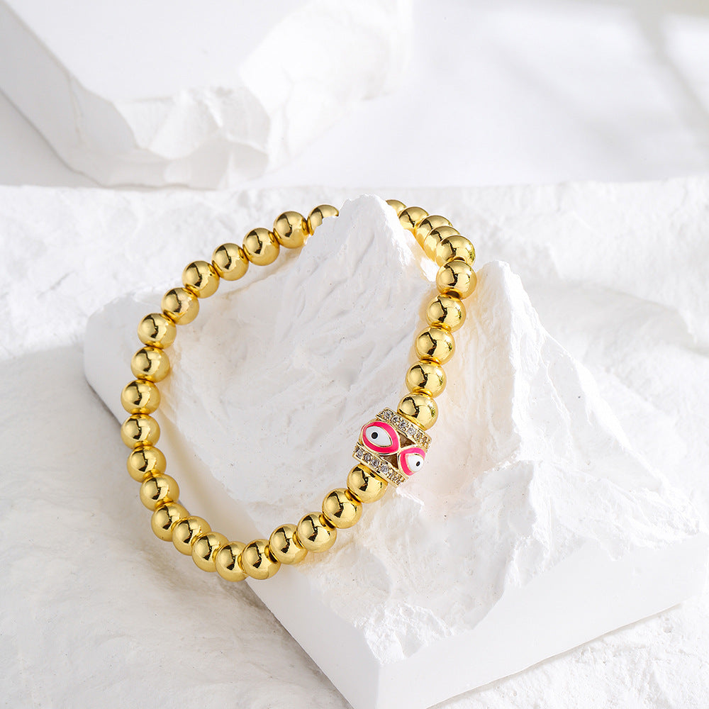 Bracciale sottile da donna geometrico minimalista con amuleto dell'occhio di Allah, base in rame placcato oro 18 carati e zirconia incastonata con smalto