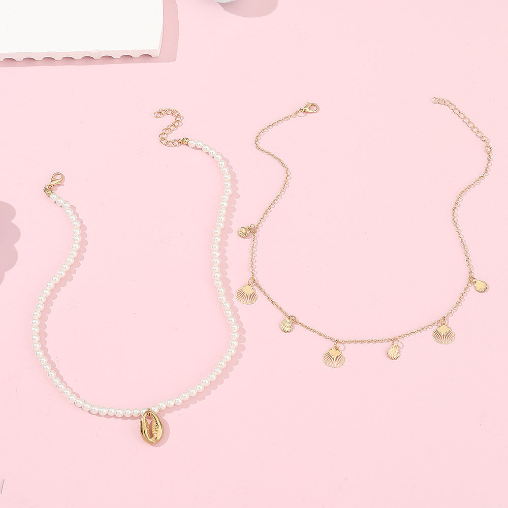 Set di collana con ciondolo a forma di conchiglia minimalista in lega per ragazze con catena di perle e finitura artigianale