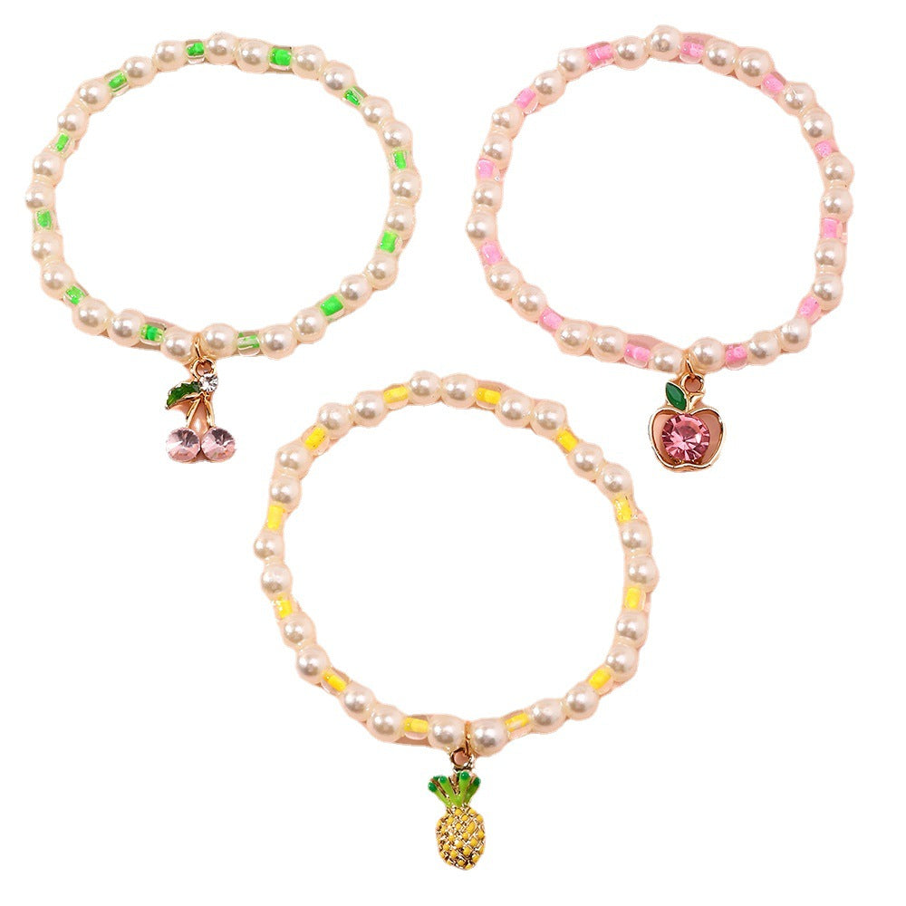Juego de pulseras infantiles con forma de fruta estilo caricatura, con detalles de perlas y base de aleación para niñas de 6 a 10 años