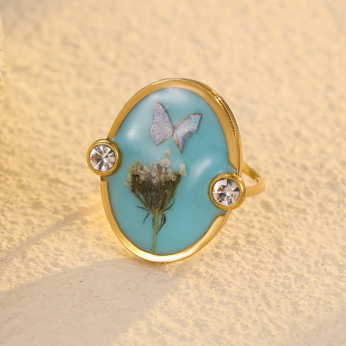 Elegante anillo de acero inoxidable con forma de corazón, lazo de resina y detalles de flores prensadas, incrustaciones de pedrería, acabado chapado para mujer
