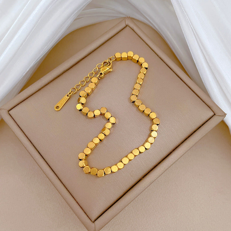 Bracciale Minimalista da Donna a Catena Box in Acciaio al Titanio Tonalità Fredde con Design Zodiacale e Intarsio in Oro