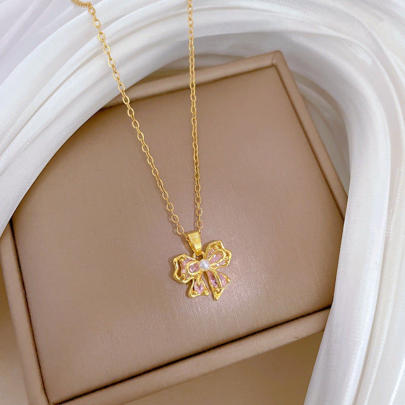 Collana con ciondolo a fiocco rosa con strass da donna in acciaio al titanio con delicata catena a medaglione