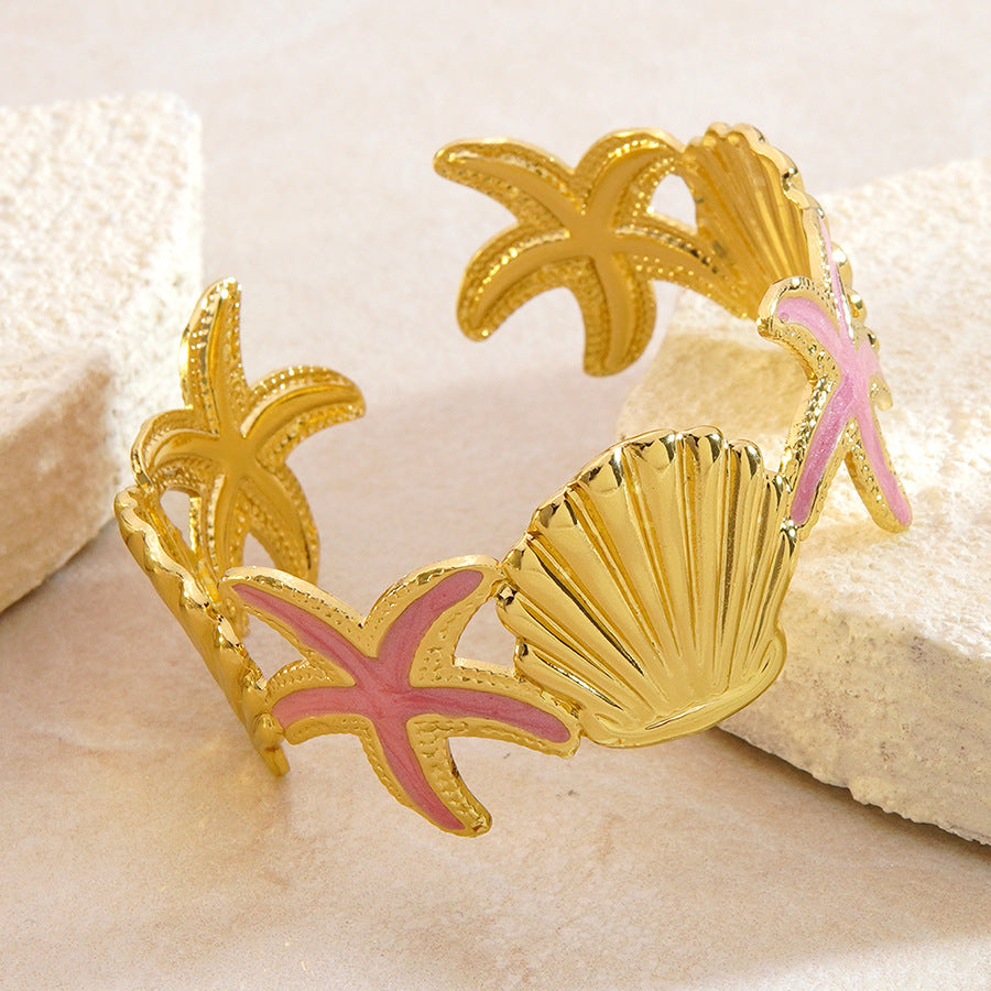 Bracciale a polsino in acciaio inossidabile con gocciolamento casuale, stella marina e conchiglia