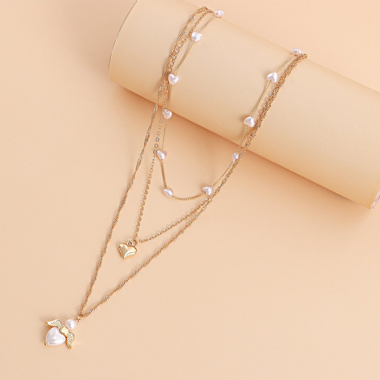 Minimalist Multi-Layer Heart-Shaped Pearl and Angel Wing Necklace for Women in Alloy with Plated Finish