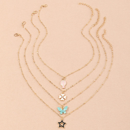 Set Collana per Bambini con Ciondoli a Cartone Animato Farfalla Stella Quadrifoglio Mongolfiera in Lega Smalto con Catena a Scatola