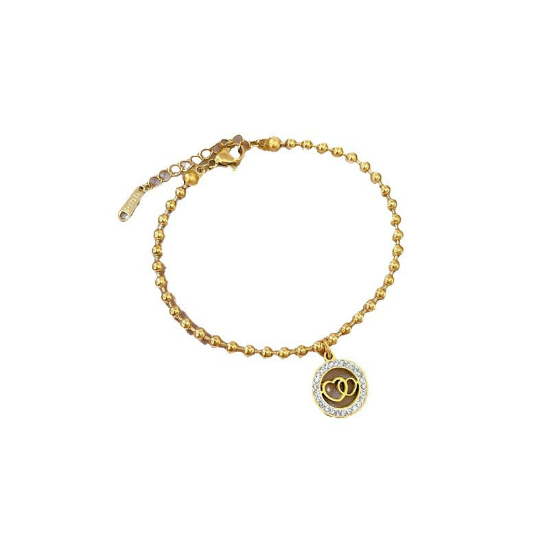 Retro Minimalist Double-Ring Heart Bracelet for Women Made of Titanium Steel with Gold Plating and Wavy Texture