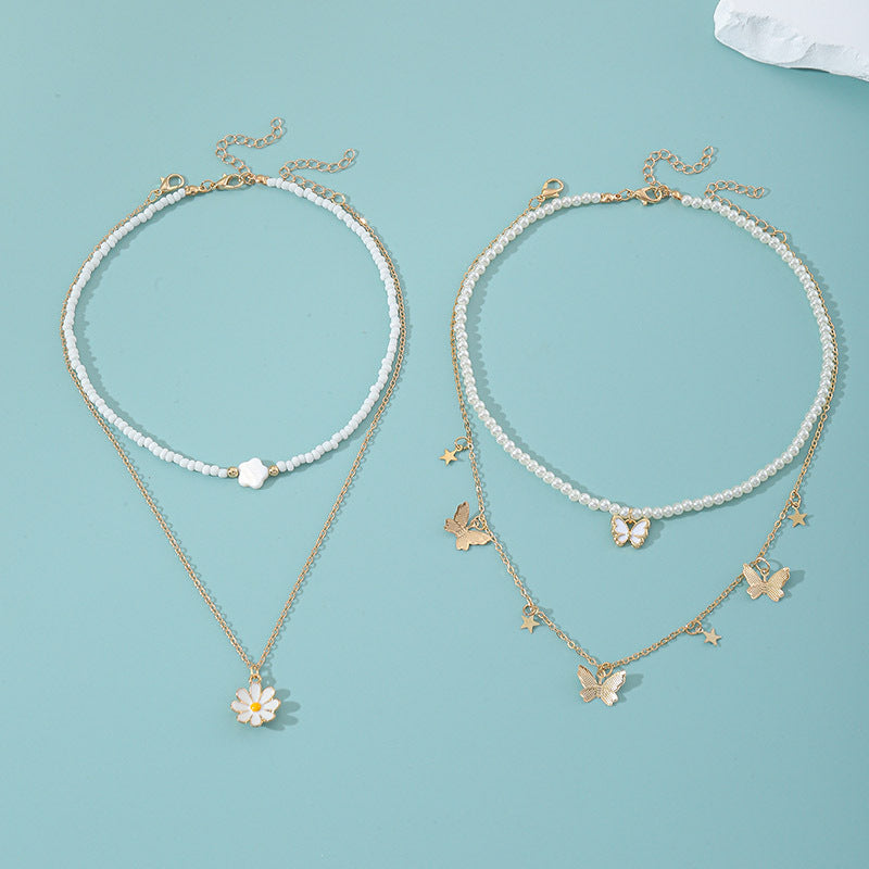 Set collana con pendente a farfalla rosa e floreale per bambini con perle in resina e ciondolo in lega, finitura smaltata, catena a sfere rotonde