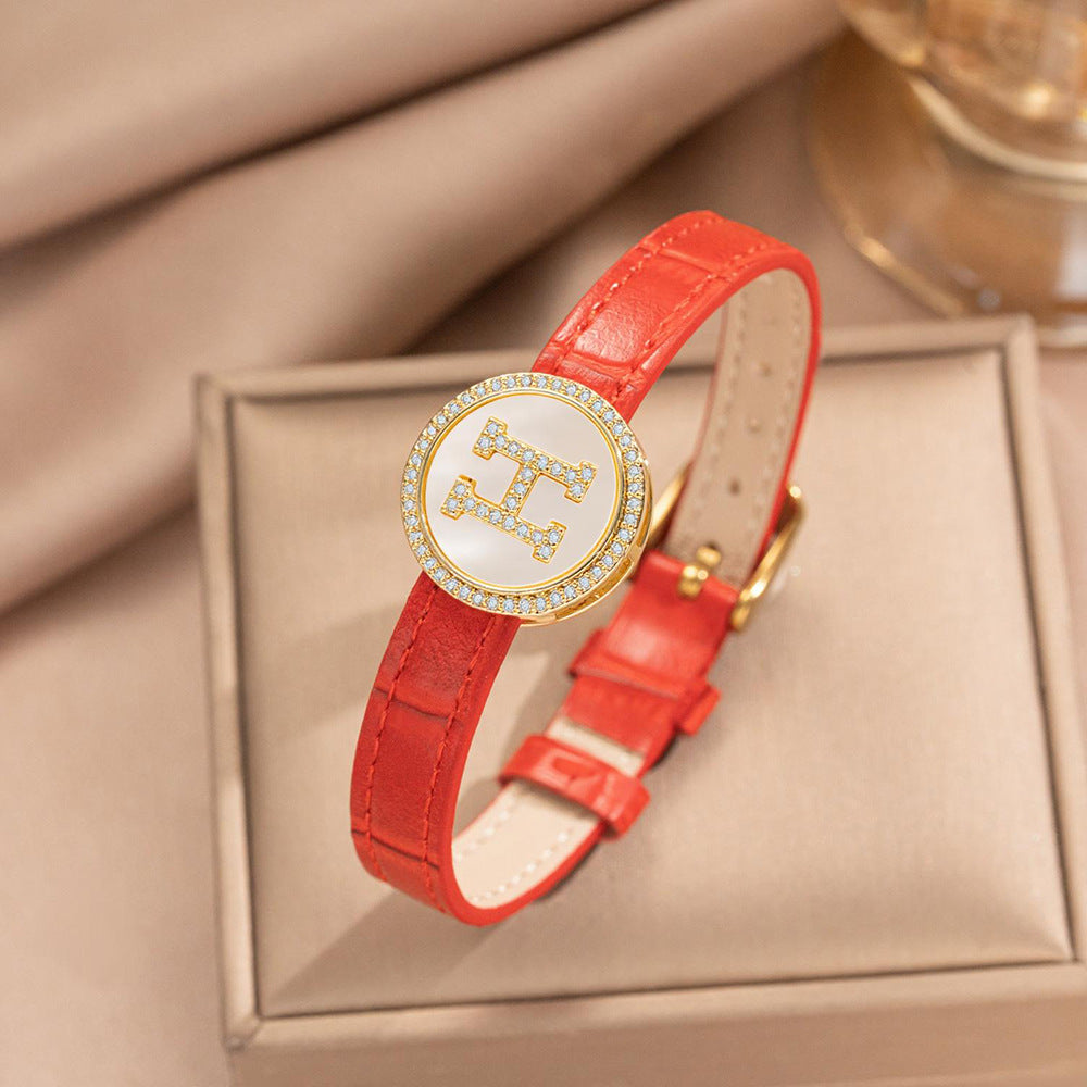 Pulsera de puño redonda chapada en oro de acero inoxidable minimalista con correa de cuero genuino para hombres y mujeres