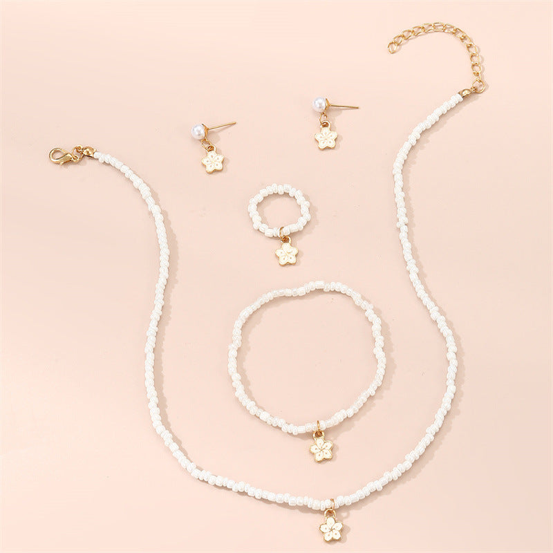 Set di collana con perline di vetro floreali minimaliste carine con bracciale anello e orecchini abbinati per bambini