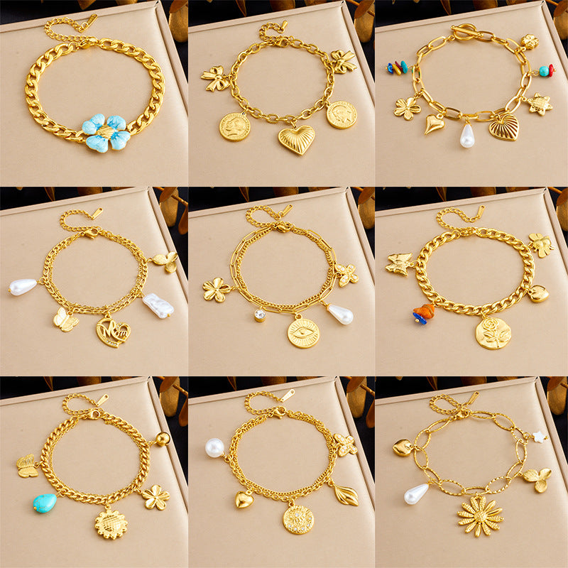 Bracciale con ciondolo floreale e a cuore in stile vintage in acciaio inossidabile con finitura placcata da donna