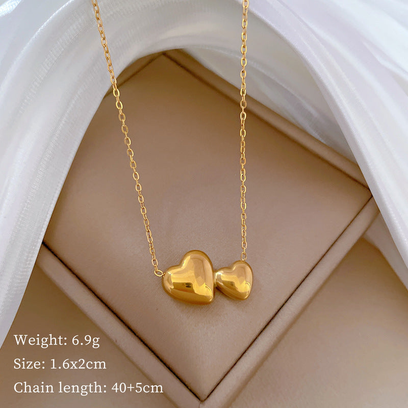 Collana Minimalista Unisex con Doppio Cuore Geometrico in Acciaio al Titanio