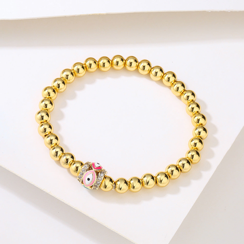 Bracciale sottile da donna geometrico minimalista con amuleto dell'occhio di Allah, base in rame placcato oro 18 carati e zirconia incastonata con smalto