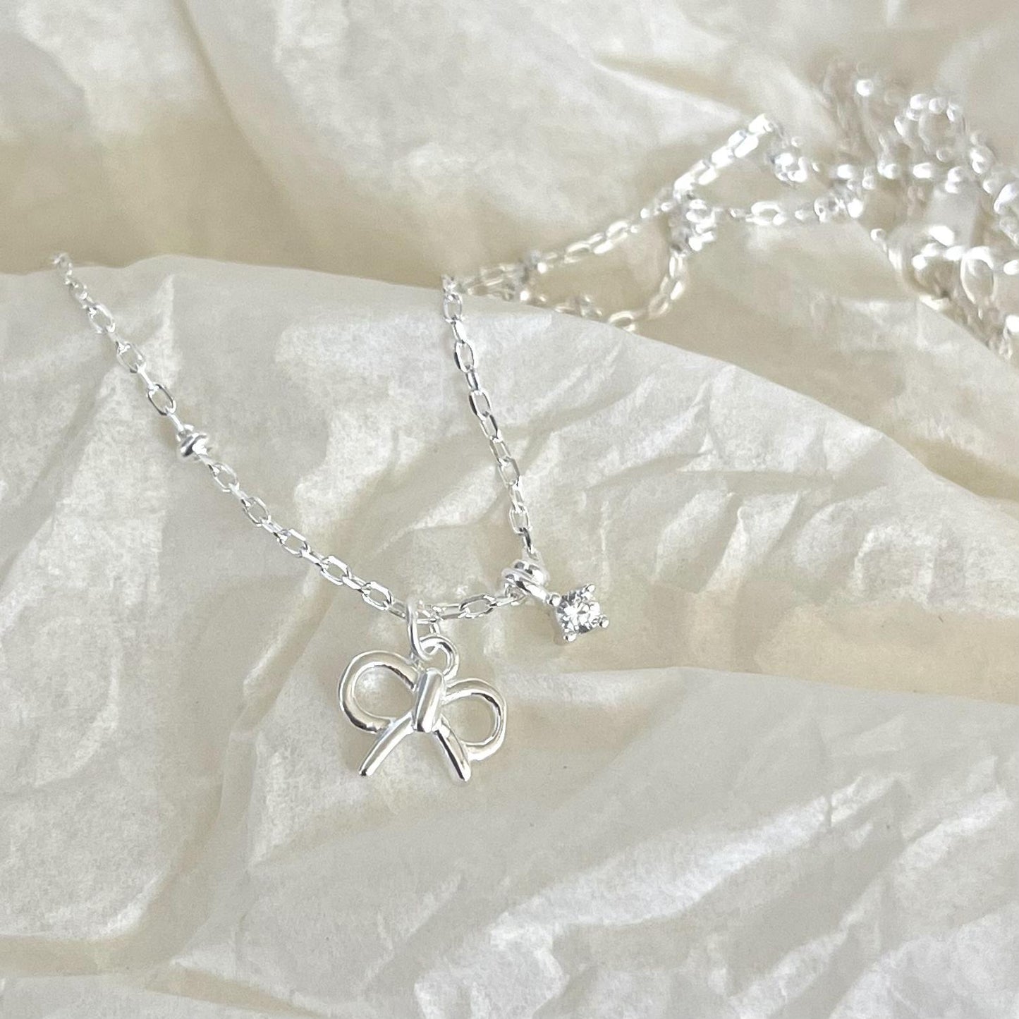 Minimalist Bowknot Pendant Necklace in 925 Sterling Silver with Cubic Zirconia Accents on Beaded Chain