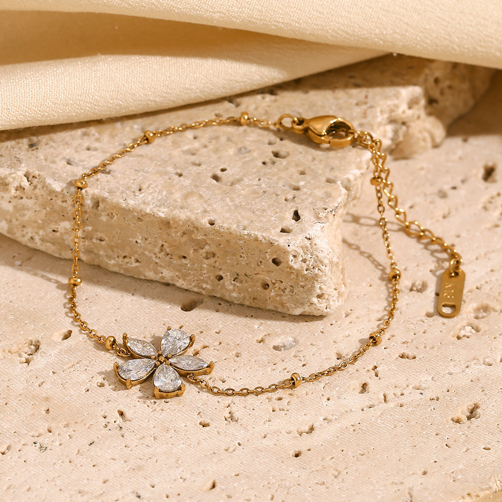Bracciale da donna placcato oro 18 carati in acciaio inossidabile con fiore di zircone, motivo floreale alla moda