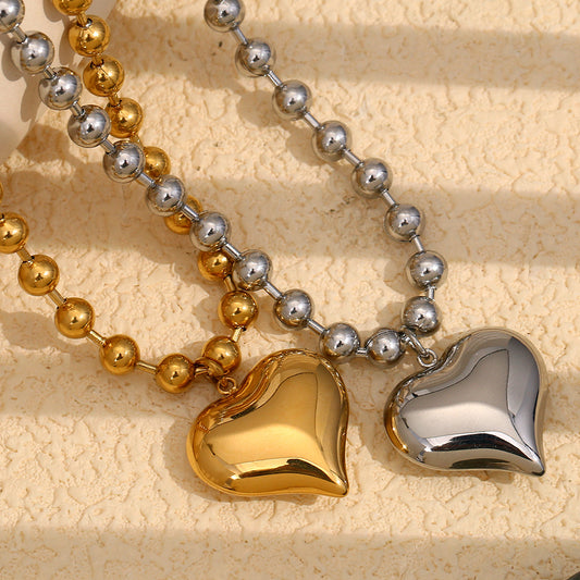 Collana con ciondolo a forma di cuore alla moda in acciaio inossidabile placcato oro 18 carati da donna