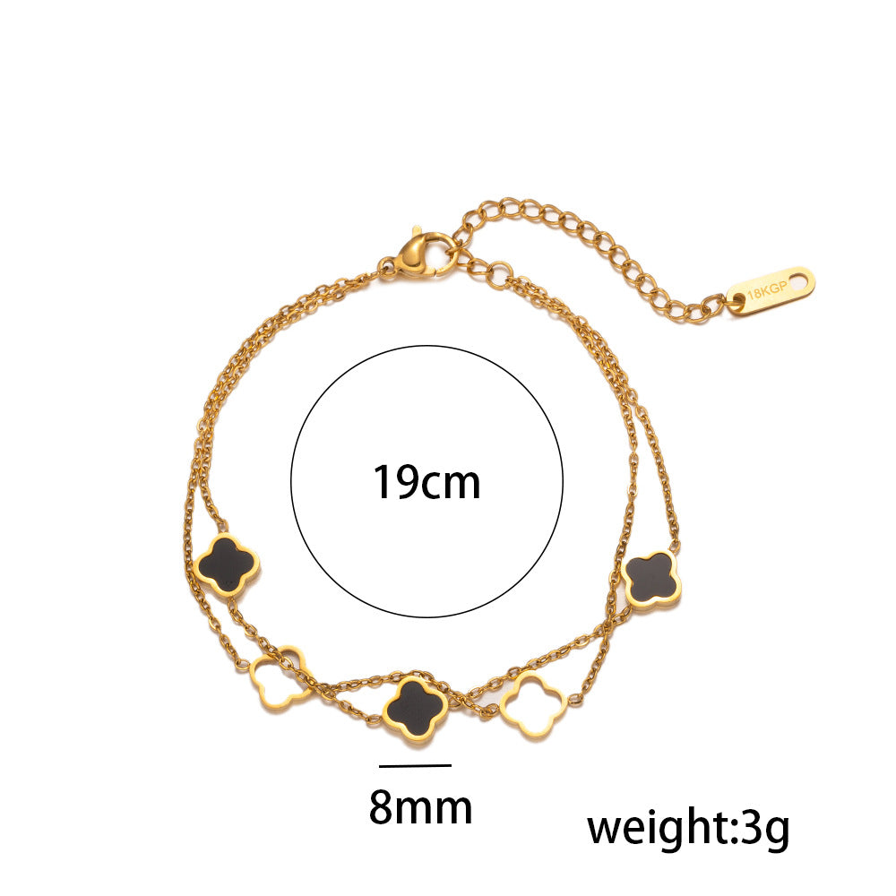 Bracciale da donna placcato in acciaio al titanio 18K con quadrifoglio cavo a doppio strato alla moda