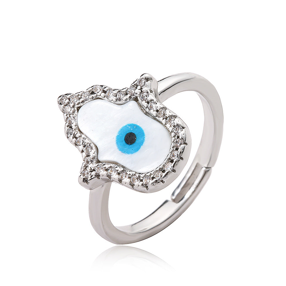 Anello da donna minimalista geometrico in rame placcato oro con micro-pavé di zirconi a forma di occhio turco