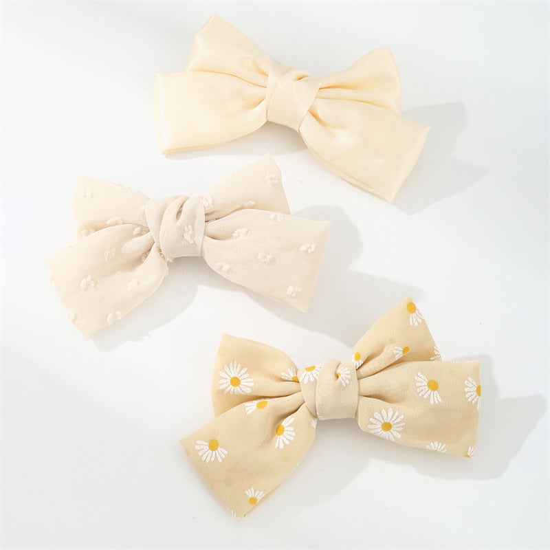 Set di fermagli per capelli minimalisti con fiocco a margherita per bambini in tessuto con palette di colori macaron e texture a maglia